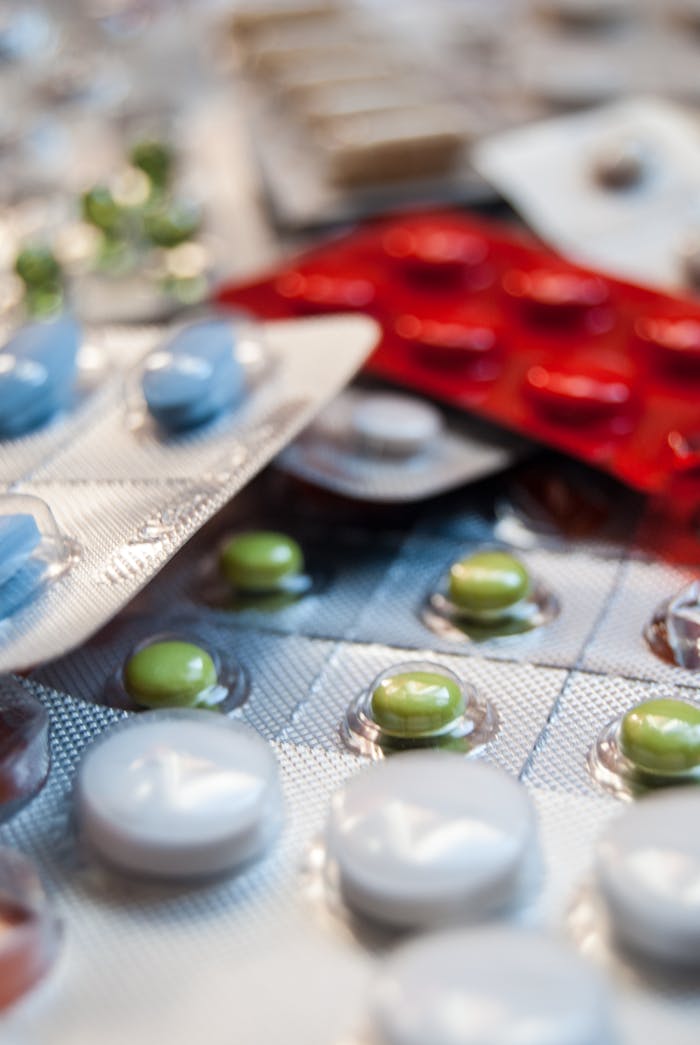 creative Close-up of various prescription pills in blister packs, highlighting medication diversity.